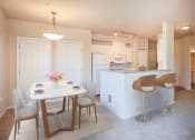 Thumbnail 4 of 40 - Kitchen With Dining Area at Metropolitan Collection Apartments, Renton, 98057