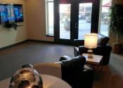 Thumbnail 30 of 40 - Community Room with TV at Metropolitan Collection Apartments, Renton, WA, 98057