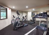 Thumbnail 35 of 40 - Cardio Machines In Gym at Metropolitan Collection Apartments, Renton, WA