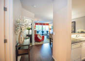 Thumbnail 12 of 30 - Living Room With Kitchen View at Metropolitan Place Apartments, Renton