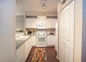 Thumbnail 5 of 30 - Kitchen With White Cabinetry And Appliances at Metropolitan Place Apartments, Renton, WA, 98057
