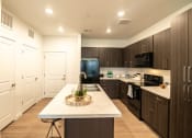 Thumbnail 14 of 38 - Large Kitchen with Island  at Garden Lofts Apartments, Utah, 84101