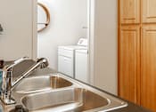 Thumbnail 13 of 33 - Stainless Steel Sink With Faucet In Kitchen at Four Seasons at Southtowne Apartments, South Jordan, UT, 84095