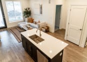 Thumbnail 9 of 29 - Open Concept Living Room and Kitchen at The Arza, American Fork 84003