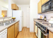 Thumbnail 9 of 21 - Modern Kitchen With Custom Cabinets at Chesapeake Commons Apartments, California, 95670