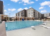 Thumbnail 24 of 48 - Outdoor Cabanas by Pool at The Arza Apartments