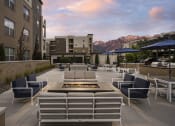 Thumbnail 24 of 41 - Outdoor Resident Lounge with Fireplaces at Parc View Apartments and Townhomes Midvale, UT 84047