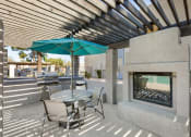 Thumbnail 23 of 29 - Outdoor Seating and Fireplace at Aztec Springs