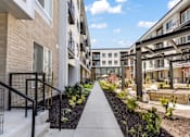Thumbnail 27 of 48 - Outdoor Walkway at The Arza Apartments
