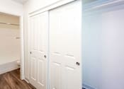 Thumbnail 8 of 20 - Main Bedroom Closet with Panel Doors and Ensuite Bathroom  at River Oaks Apartments & Townhomes, Hanford, CA