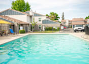 Thumbnail 1 of 20 - Poolside Relaxing Area at River Oaks Apartments & Townhomes, Hanford, 93230