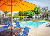 Thumbnail 15 of 20 - Poolside Dining Tables at River Oaks Apartments & Townhomes, Hanford, California