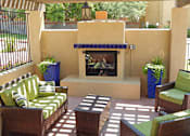 Thumbnail 8 of 18 - Huge Outdoor Brick Fireplace at River Point Apartments, Arizona, 85712