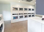 Thumbnail 13 of 18 - Community Laundry Room at River Point Apartments, Tucson, 85712