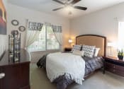 Thumbnail 6 of 23 - Well Decorated Primary Bedroom With Natural Light at Canyon Ridge Apartments, Arizona