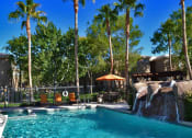 Thumbnail 12 of 23 - Glimmering Pool at Canyon Ridge Apartments, Surprise, AZ
