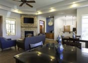 Thumbnail 16 of 23 - Clubroom With Smart Tv And Fireplace at Canyon Ridge Apartments, Arizona