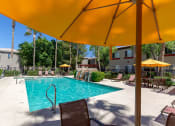 Thumbnail 19 of 23 - Poolside Dining Tables at Canyon Ridge Apartments, Surprise, AZ