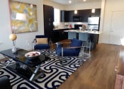 Thumbnail 7 of 40 - Warm Living And Dining Room at Lofts at 7800 Apartments, Midvale