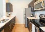 Thumbnail 9 of 38 - Refrigerator And Kitchen Appliances at Parc on Center Apartments & Townhomes, Orem, 84057