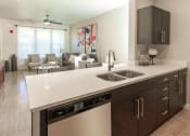 Thumbnail 8 of 38 - Modern Kitchen With Custom Cabinet at Parc on Center Apartments & Townhomes, Utah