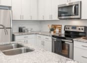 Thumbnail 7 of 41 - Granite Counter Tops In Kitchen at Parc View Apartments & Townhomes, Midvale, UT