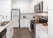 Thumbnail 12 of 41 - Kitchen With Ample Storage at Parc View Apartments & Townhomes, Midvale, UT