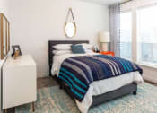 Thumbnail 14 of 41 - Beautiful Guest Bedroom With Wide Windows at Parc View Apartments & Townhomes, Midvale, Utah