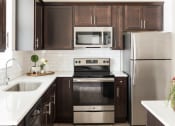 Thumbnail 2 of 39 - Fully Equipped Kitchen With Stainless Steel Appliances at Rivulet Apartments, American Fork, UT