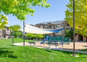 Thumbnail 33 of 39 - Shaded Play Area at San Tropez Apartments & Townhomes, Utah, 84095