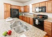 Thumbnail 13 of 39 - Gourmet Kitchen With Island at San Tropez Apartments & Townhomes, South Jordan