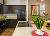 Thumbnail 3 of 38 - Granite Countertop Kitchen Island at Talavera at the Junction Apartments & Townhomes, Midvale, UT, 84047
