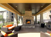 Thumbnail 23 of 38 - Garden Courtyard With Grills And Fireplace at Talavera at the Junction Apartments & Townhomes, Midvale, 84047