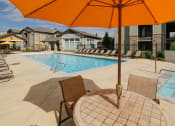 Thumbnail 33 of 38 - Poolside Dining Tables at Talavera at the Junction Apartments & Townhomes, Midvale, UT, 84047