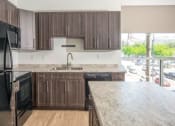 Thumbnail 8 of 36 - Granite Counter Tops In Kitchen at 600 Lofts Apartments, Salt Lake City, UT, 84111