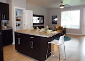 Thumbnail 16 of 36 - Full Kitchen With Island Dining at Enclave at 1400 South Apartments, Utah, 84115