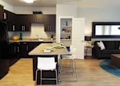 Thumbnail 4 of 36 - Island Kitchen and Open Living Space at Enclave at 1400 South Apartments, Salt Lake City, UT