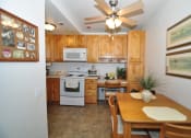 Thumbnail 5 of 18 - Kitchen & Dining Room at Heritage Park Senior Apartments - Norco CA