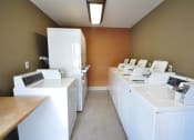 Thumbnail 8 of 15 - Community Laundry Center at  Peppertree Senior Apartments  - Near San Diego California