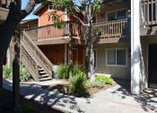 Thumbnail 13 of 17 - Courtyard View at Village Grove Apartments, California