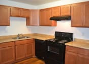 Thumbnail 3 of 17 - Electric Range In Kitchen at Village Grove Apartments, Escondido, CA, 92025