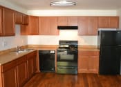 Thumbnail 4 of 17 - Fully Equipped Kitchen at Village Grove Apartments, Escondido, CA