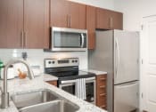 Thumbnail 24 of 61 - Gourmet Kitchen with Granite Countertops & Stainless Steel Appliances