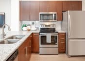 Thumbnail 25 of 61 - Gourmet Kitchen with Granite Countertops & Stainless Steel Appliances