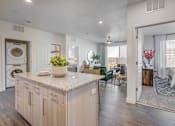 Thumbnail 10 of 45 - A kitchen with a washer and dryer built in.
