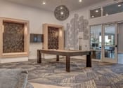 Thumbnail 30 of 45 - A modern living room with a grey carpet and a wooden table.