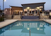 Thumbnail 25 of 40 - Parc Ridge Pool with Clubhouse Behind