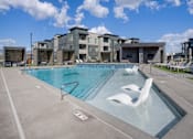 Thumbnail 14 of 40 - Pool with Chairs at Amara