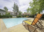 Thumbnail 13 of 21 - Pool With Sunning Deck at Chesapeake Commons Apartments, California, 95670