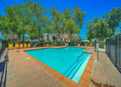 Thumbnail 14 of 21 - Large Swimming Pool at Chesapeake Commons Apartments, California